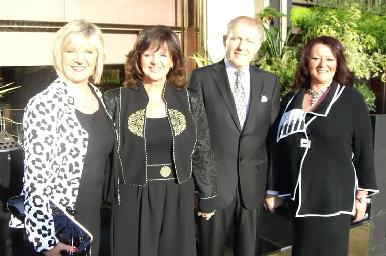Margaret Miles-Bramwell after receiving her OBE with Caryl Richards her husband Tony and daughter Claire