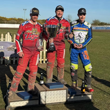 Cornishman Chris Harris (centre) celebrates his Championship League Riders’ title  success alongside Kyle Howarth (left) and Steve Worrall (right)