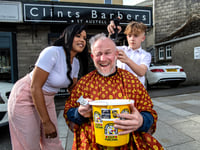Bionic Boxing Barber Clint has head shaved to raise awareness