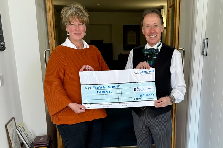 David Bray (right) presenting the cheque to Penhaligon's Friends