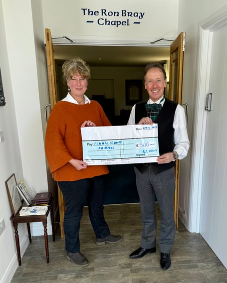 David Bray (right) presenting the cheque to Penhaligon's Friends