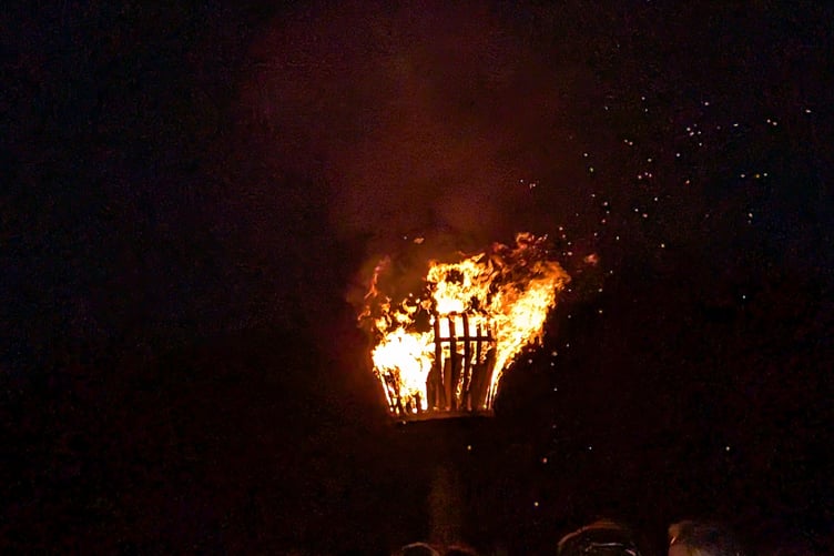The lit beacon burns bright in the night at the Bodmin Beacon nature reserve as part of VE Day 80 celebrations (Picture: Aaron Greenaway/Tindle)
