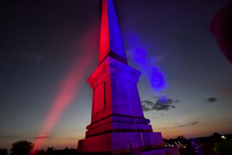 The lit beacon burns bright in the night at the Bodmin Beacon nature reserve as part of VE Day 80 celebrations (Picture: Aaron Greenaway/Tindle)