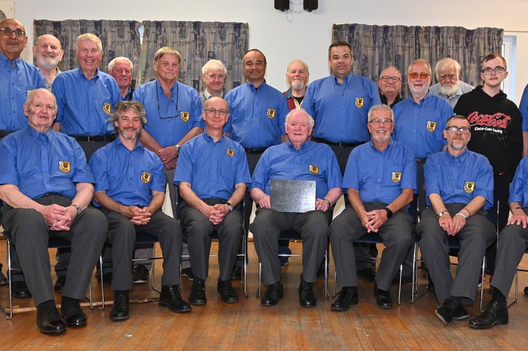 Wadebridge Male Voice Choir's longest serving chorister Mr Dudley Halling was presented with a special crafted plaque to celebrate his long service. (Picture: Adrian Jasper)