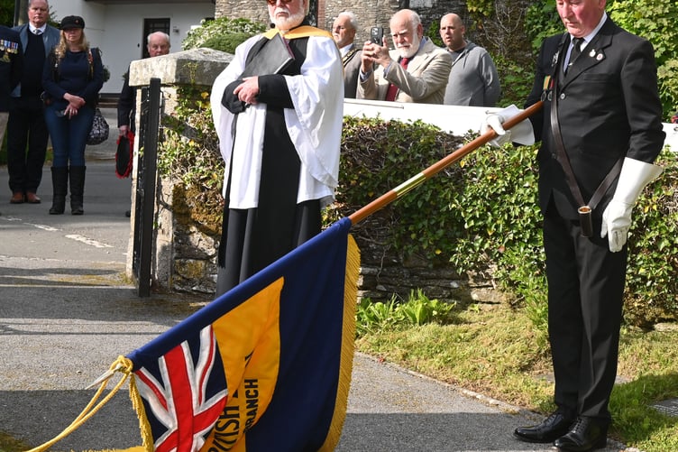 Standard Bearer Phil Williams lowers the British Legion flag to the fallen (Picture: Adrian Jasper)