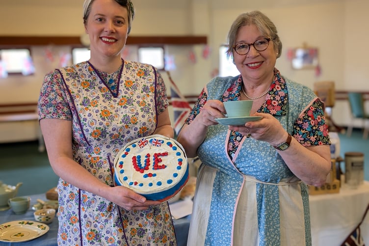 Laura and Pam, the duo behind the excellent Homefront Kitchen Girls, with a cup of tea and VE day victory cake. (Picture: Aaron Greenaway)