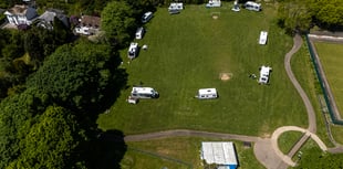 Travellers move into town park in Cornwall with cars and caravans