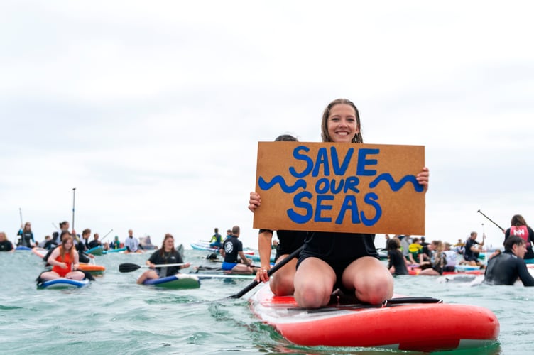 Protestors get their message across during one of the many paddle-outs organised by Surfers Against Sewage in relation to the amount of raw sewage being pumped into coastal waters