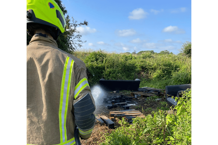 Fire crews from Wadebridge Community Fire Station extinguishing the pallet fire (Picture: Cornwall Fire and Rescue Service)