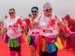 Runners covered in the colours of the rainbow for charity fun run