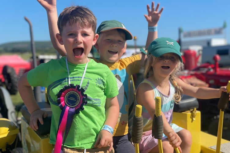 These youngsters are all smiles as they enjoyed a fun-filled day out at the 120th Liskeard Show held at Merrymeet on Saturday