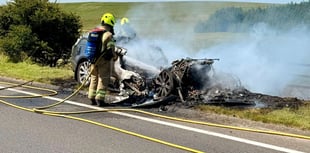 Vehicle and hay bales destroyed