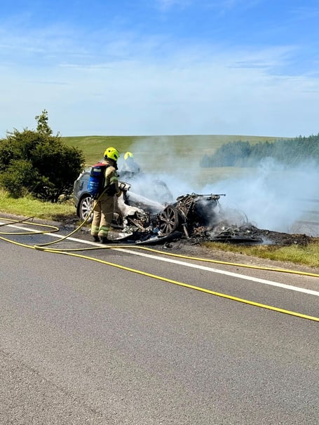 Fire crews extinguishing the car which caught on fire at Bolventor. (Picture: Launceston Community Fire Station)