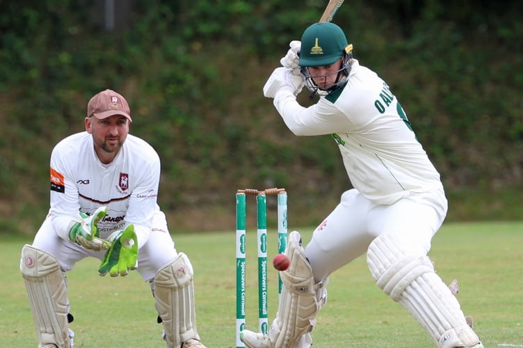 The returning Ollie Allsop eyes up a shot into the off-side during Callington’s ECB Cornwall Premier League clash with Redruth at Moores Park as wicketkeeper Peter Howells watches on. (Picture: Glen Rogers).