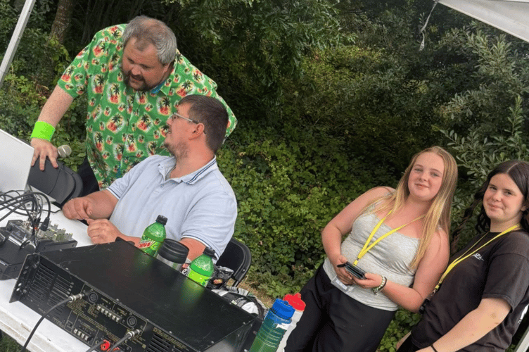 NCB Radio presenter Aaron James pictured alongside Brad Angove, the 'heavy lifter' and sound tech for the day and two of the young people of KBSK (Picture: KBSK)