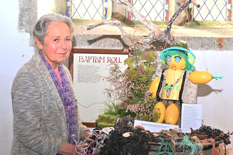 Caroline Hooper, St Breward church warden, shows off one of the many displays created by Fran Calver entitled "The Story of Buoy Bob" made with everything collected from the local beach. (Picture: Adrian Jasper)