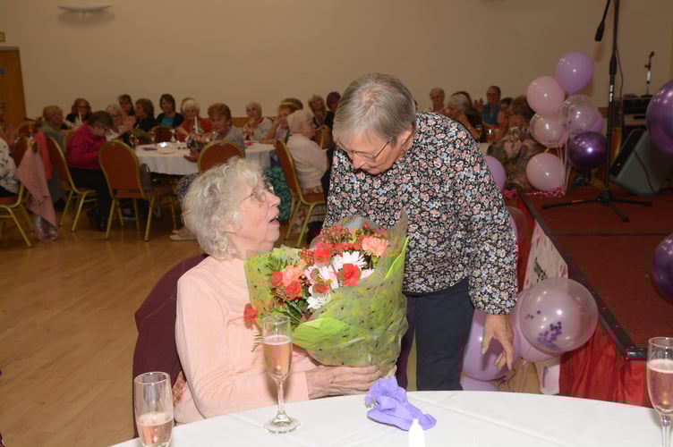 Elaine Walter from Pyworthy was surprised to receive a bouquet of flowers during the evening celebrations