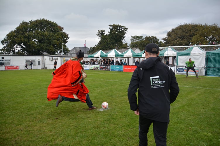 Cllr Jon Hutchings taking part in a penalty shootout in full mayoral robes. The penalty was missed. (Picture: Rodney Parrish)