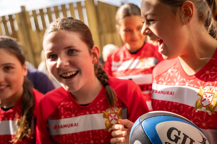 Girls about to enter the new changing rooms for the first time.