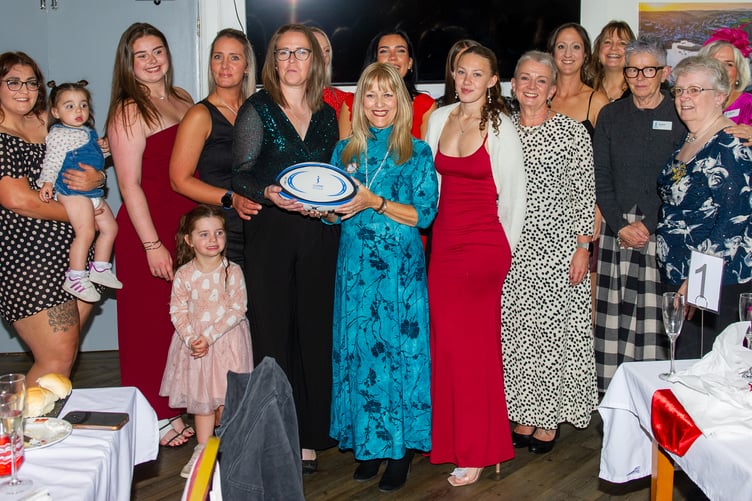 Valkyries team manager Stephanie Trudgian receives a “soroptimist” rugby ball from Jennie Walker of Kernow Soroptimists.