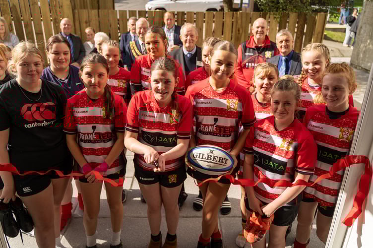 St Austell Girls cut the ribbon with members of Mark Master Masons and club chairman Paul Hayes looking on.