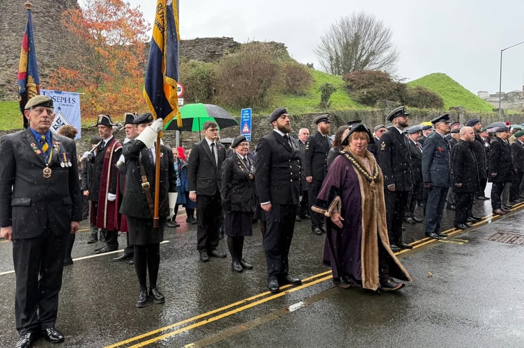 Mayor of Launceston Cllr Nicola Gilbert is pictured with members of the Royal British Legion, including chairman (right) John Harrison and standard bearer Victoria deCourcy-Harrison, along side other serving and former members of the Armed Forces