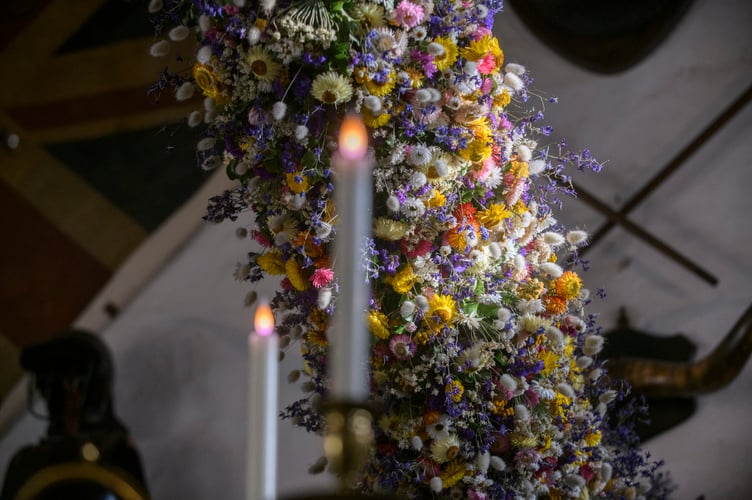 Record-breaking year for Cotehele's famous Christmas Garland
38,000 dried flowers grown, harvested and hand-placed at the National Trust estate in Cornwall

Cotehele celebrates its biggest ever garland, created from 38,000 home-grown flowers
deal growing conditions made 2025 a bumper year for key blooms including paper daisies, bunny tails and statice
 Visitors can see the full 60ft garland in the Great Hall daily from Saturday, 22nd November - Monday, 5th January (closed 25th - 26th December), 10.30am - 4pm
Cotehele's celebrated Christmas Garland has reached record heights this year, as gardeners announce a remarkable 38,000 flowers grown, picked, stripped, dried and prepared on site for the 2025 display.
Thanks to a near-perfect spring and summer - with a balanced mix of sunshine, warmth and timely rainfall - the garden team enjoyed one of their most successful growing seasons in decades