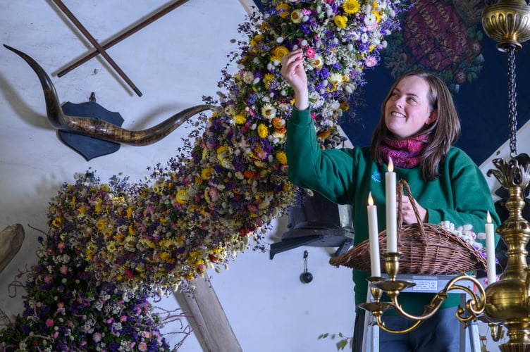 Record-breaking year for Cotehele's famous Christmas Garland38,000 dried flowers grown, harvested and hand-placed at the National Trust estate in CornwallCotehele celebrates its biggest ever garland, created from 38,000 home-grown flowersdeal growing conditions made 2025 a bumper year for key blooms including paper daisies, bunny tails and statice Visitors can see the full 60ft garland in the Great Hall daily from Saturday, 22nd November - Monday, 5th January (closed 25th - 26th December), 10.30am - 4pmCotehele's celebrated Christmas Garland has reached record heights this year, as gardeners announce a remarkable 38,000 flowers grown, picked, stripped, dried and prepared on site for the 2025 display.Thanks to a near-perfect spring and summer - with a balanced mix of sunshine, warmth and timely rainfall - the garden team enjoyed one of their most successful growing seasons in decades