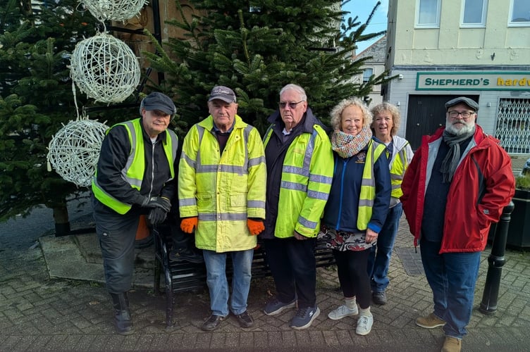 Members of Holsworthy Lions stop for a photo after helping with town's decorations (Picture: Holsworthy Lions)