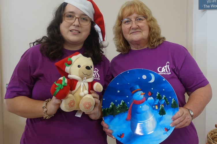 Offering plenty of Christmas items on their stall are Alex and Caroline