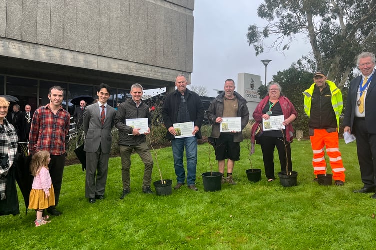 Cornwall councillor Hilary Frank (far left) and Cornwall Council chairman Rob Nolan (far right) help oversee the tree planting at  New County Hall