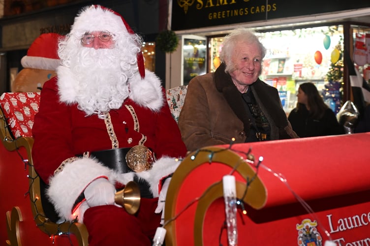 Launceston deputy town mayor John Conway gets the honour of riding with Santa (Picture: Adrian Jasper)
