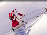 Santa shows how he gets to the ground without a chimney