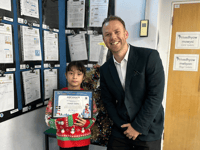 MP presents Christmas card prize to competition winner