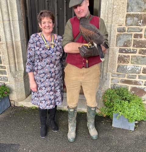 President Mandy Hamley of Bude Inner Wheel together with David Buncle of West Country Falconry and his Harris Hawk