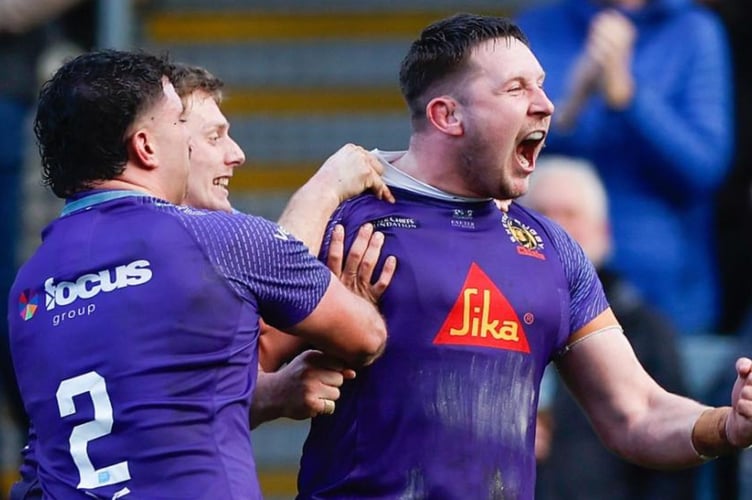 Exeter Chiefs captain Lewis Pearson celebrates after scoring his try against Sale Sharks in the Premiership Rugby Cup