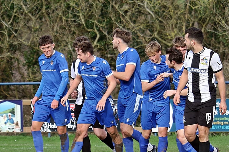 Bude celebrate Jake Woodland's goal.