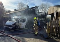 Four fire crews battle two vehicle blaze in Cardinham