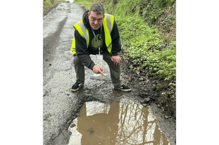 Cllr Nigel Kenneally with a pothole that is disappointing him (Picture: Stephanie Kenneally)