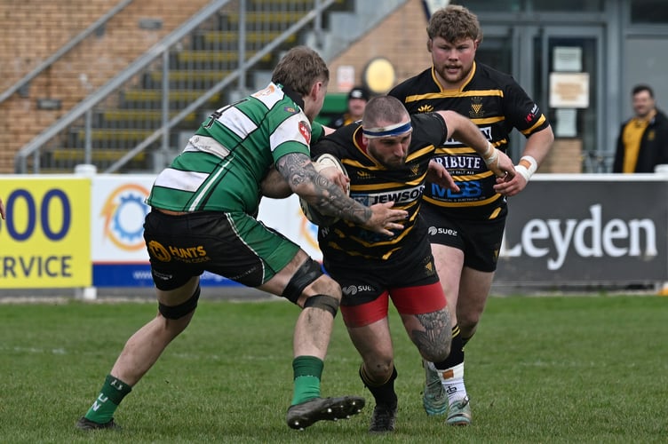 Ben Hancock of Cornwall (Launceston) is tackled by Michael Rickard of Devon (Devonport Services). - Photo mandatory by-line:  Â©Simon Bryant/Iktis Photo - 04/04/26, Cornwall, Devon, Tamar Cup, Friendly, Sport, Rugby Union, Brickfields, Plymouth, England
