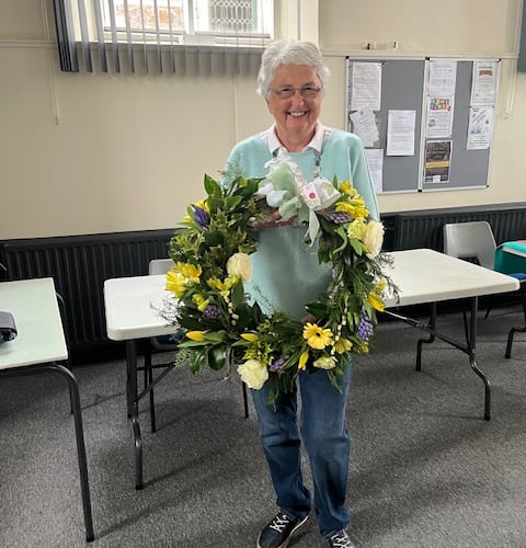 The spring door wreath created during the Marhamchurch Women's Institute meeting demonstration was gifted to Liz Vago whose birthday was closest to the date