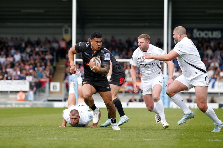 Exeter Chiefs centre Len Ikitau breaks through the heart of the Bath defence
