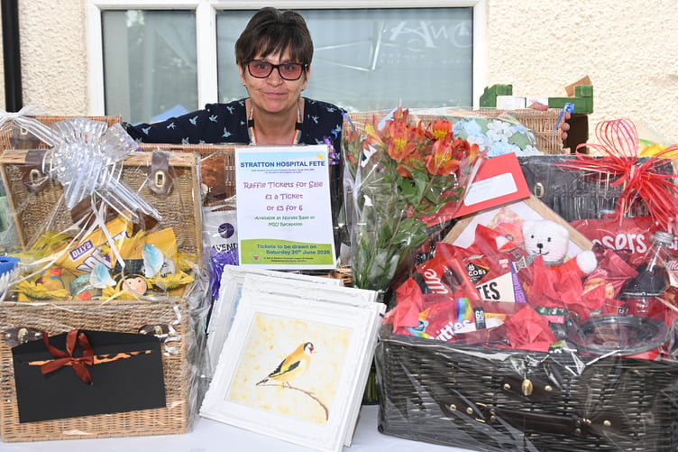Julie with some of the amazing raffle prizes on offer