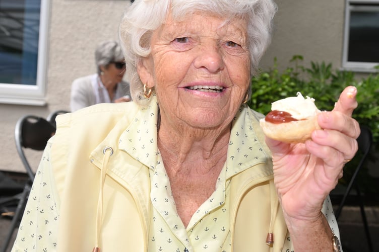 Tucking into her cream tea is Rosemary