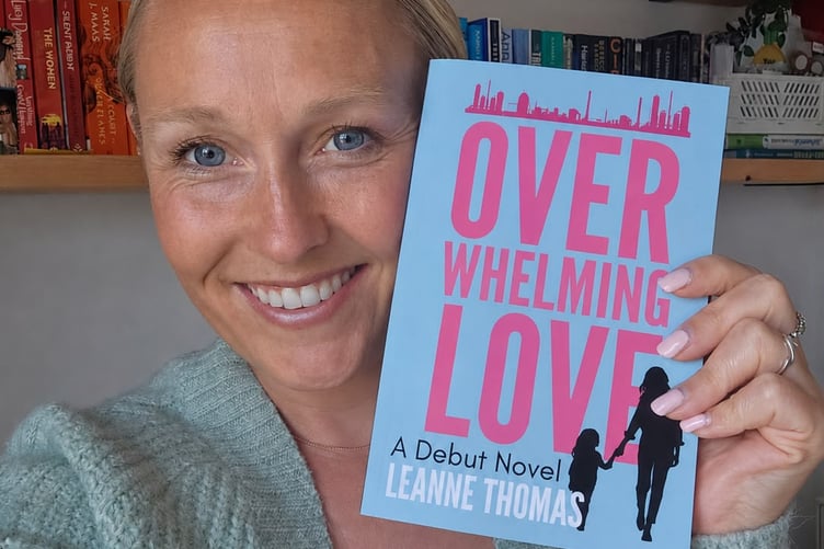 Leanne with her book Overwhelming Love