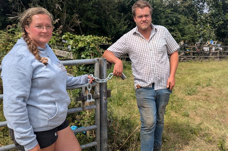 (L-R) Annie Taylor and her partner Michael Jefferies , who operate Halloon Farm, hold the chain, which was cut before  64 of their ewes and lambs were stolen (Picture: Warren Wilkins)