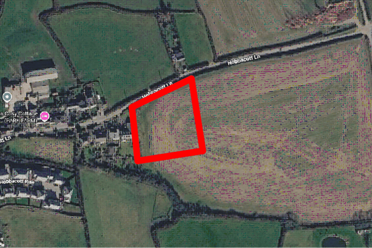 An aerial image of Marhamchurch showing the location of the land subject to the proposals in red (Picture: Cornwall Council)