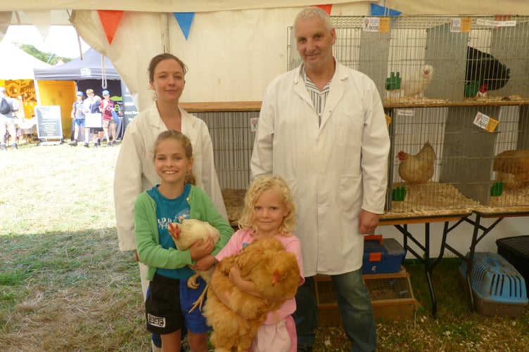 There was sisterly rivalry in the poultry tent this year, as Cora (right), aged 6, with her chicken 'Cupcake' and Bria (left), aged 8, and her chicken 'Hermione' competed against each other to see who was the best 'Young Handler'. The judge admitted it was incredibly close but Cora just pipped her sister to the win. Both were elated to be taking home ribbons and were clearly very passionate about their chickens. Proud mother Kerry Buchanan said: "They only got chickens 18 months ago and have already started their own egg selling business. But all Cora wanted for her 6th birthday was that big chicken...in the end we gave in. She was thrilled!" They are pictured with judges Ember Checkley and Derek Wakeham.