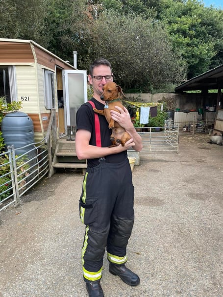 Firefighter Goodman pictured with Maxi (Picture: DSFRS)