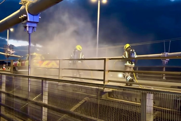 Firefighters practice how they would have initially tackled the burning car on the Tamar Bridge